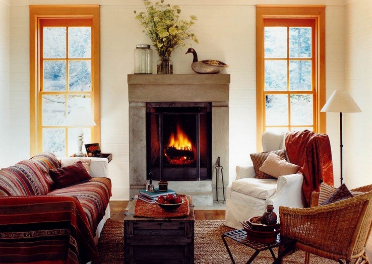 Kominek w pokoju dziennym w betonowej obudowie fot.: Bosworth Hodemaket